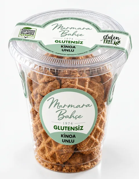 Marmara Bahçe etiketli şeffaf kapta glutensiz, kinoa unlu kurabiyeler.